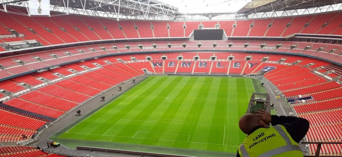 Surveyor recording as-built information inside Wembley Stadium