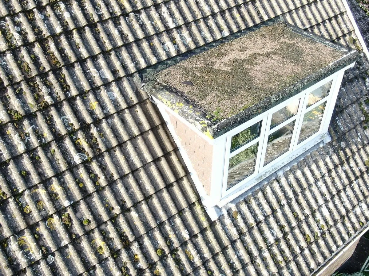 Drone photograph of a dormer window and tiled roof