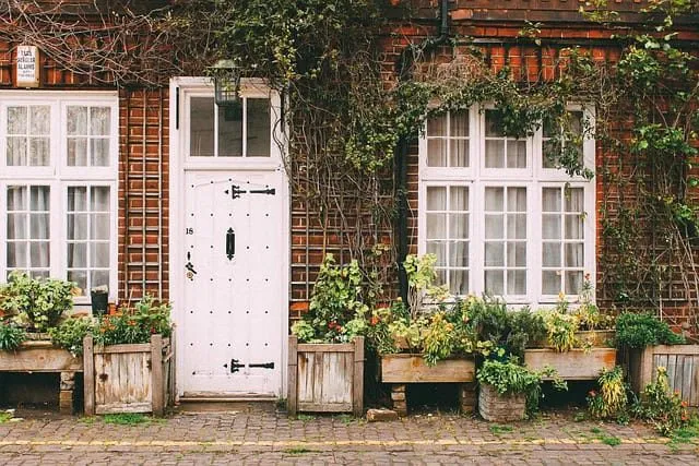 A front door and window on an old house