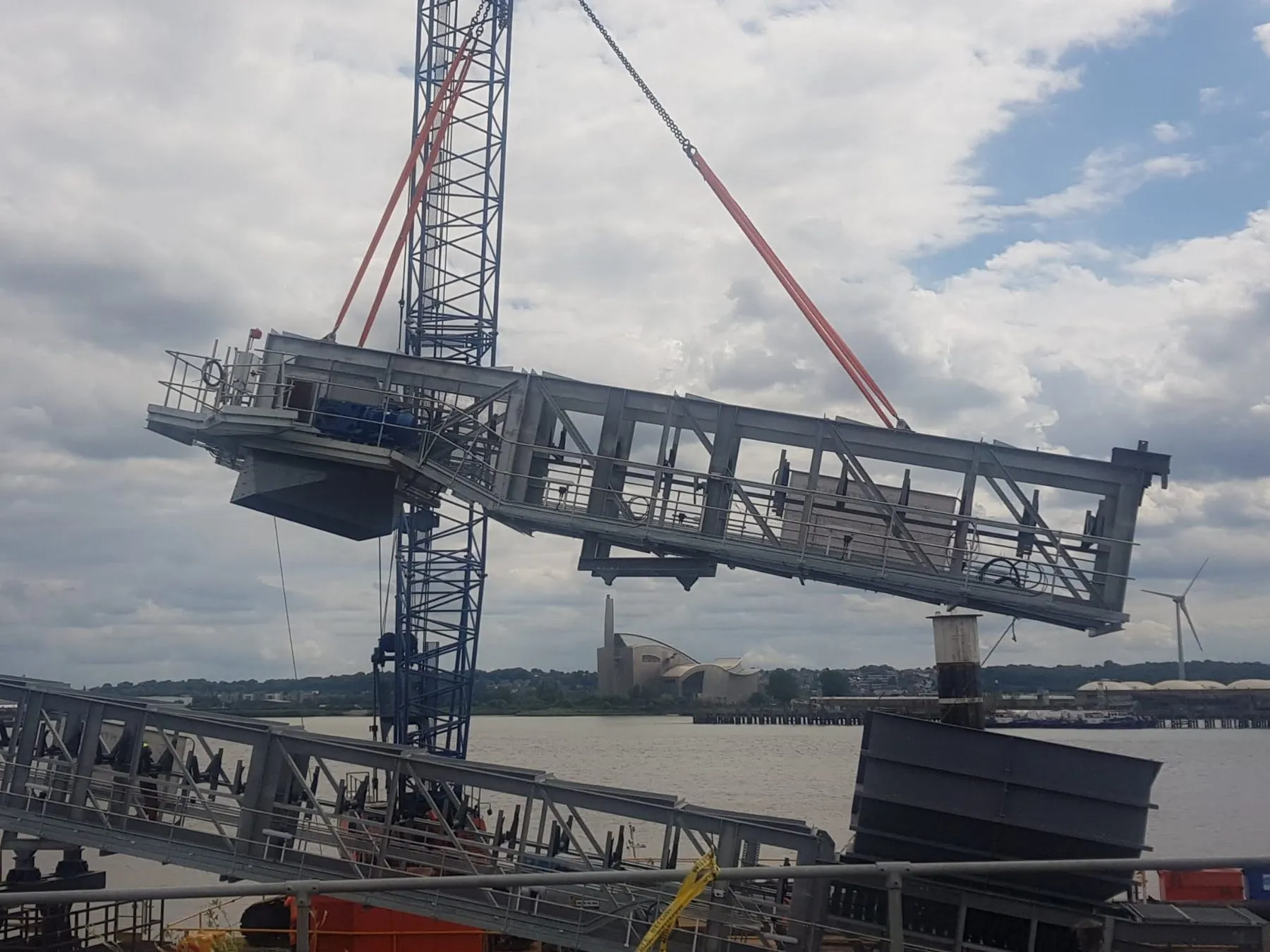 A conveyor section being lifted into place on the jetty