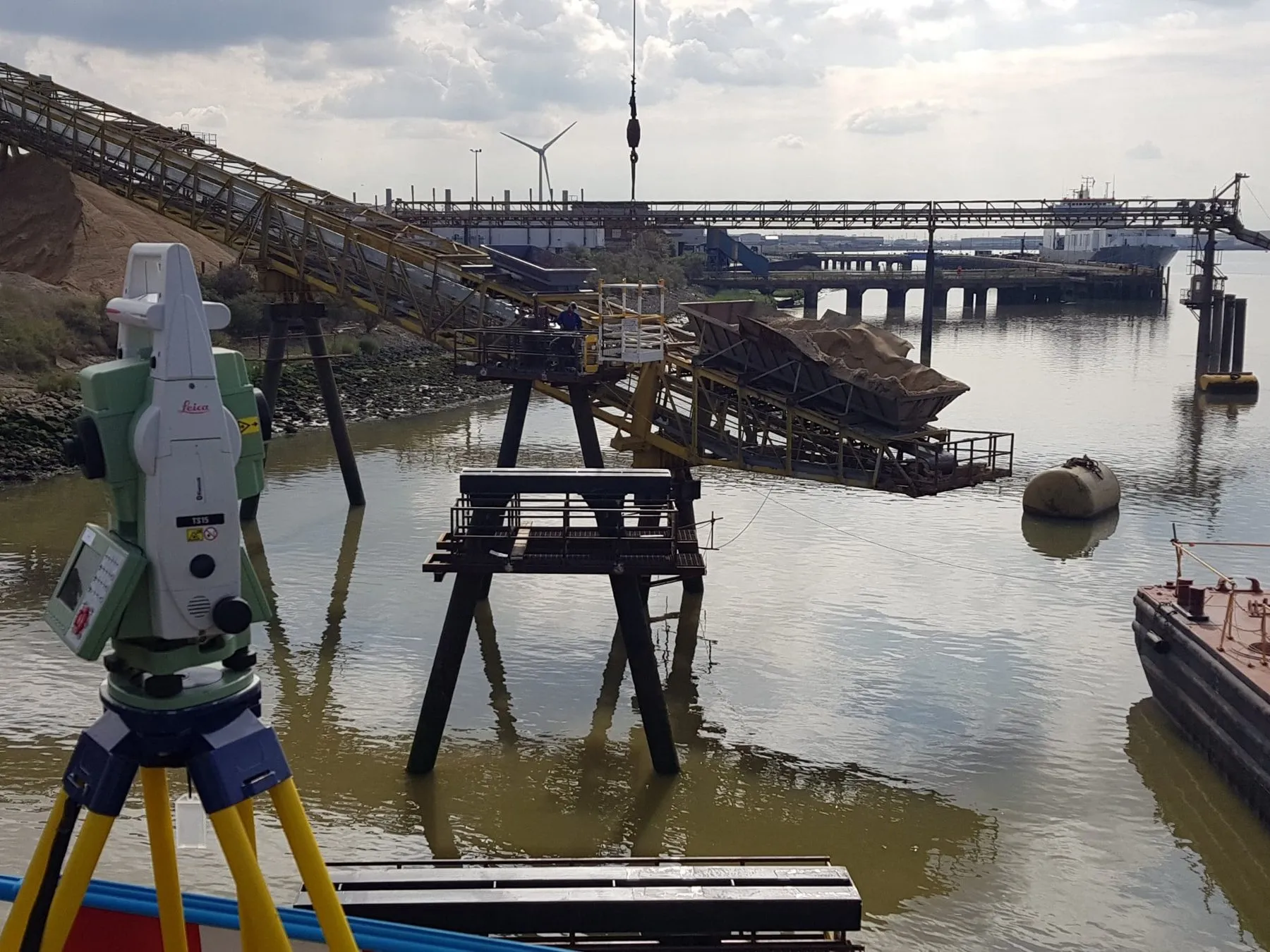 Total station set up beside the existing jetty and conveyor