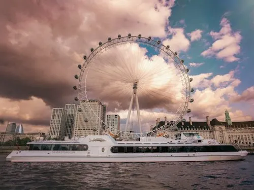 The Silver Sturgeon passenger vessel on the River Thames by the London Eye