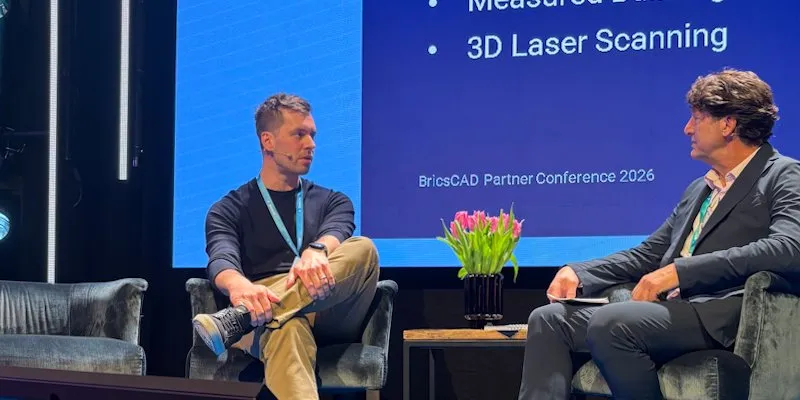 Tom Ayre speaking on stage at a BricsCAD conference