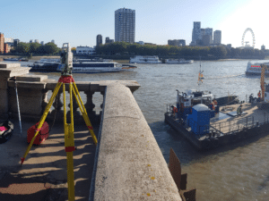 Total station working next to the River Thames in London